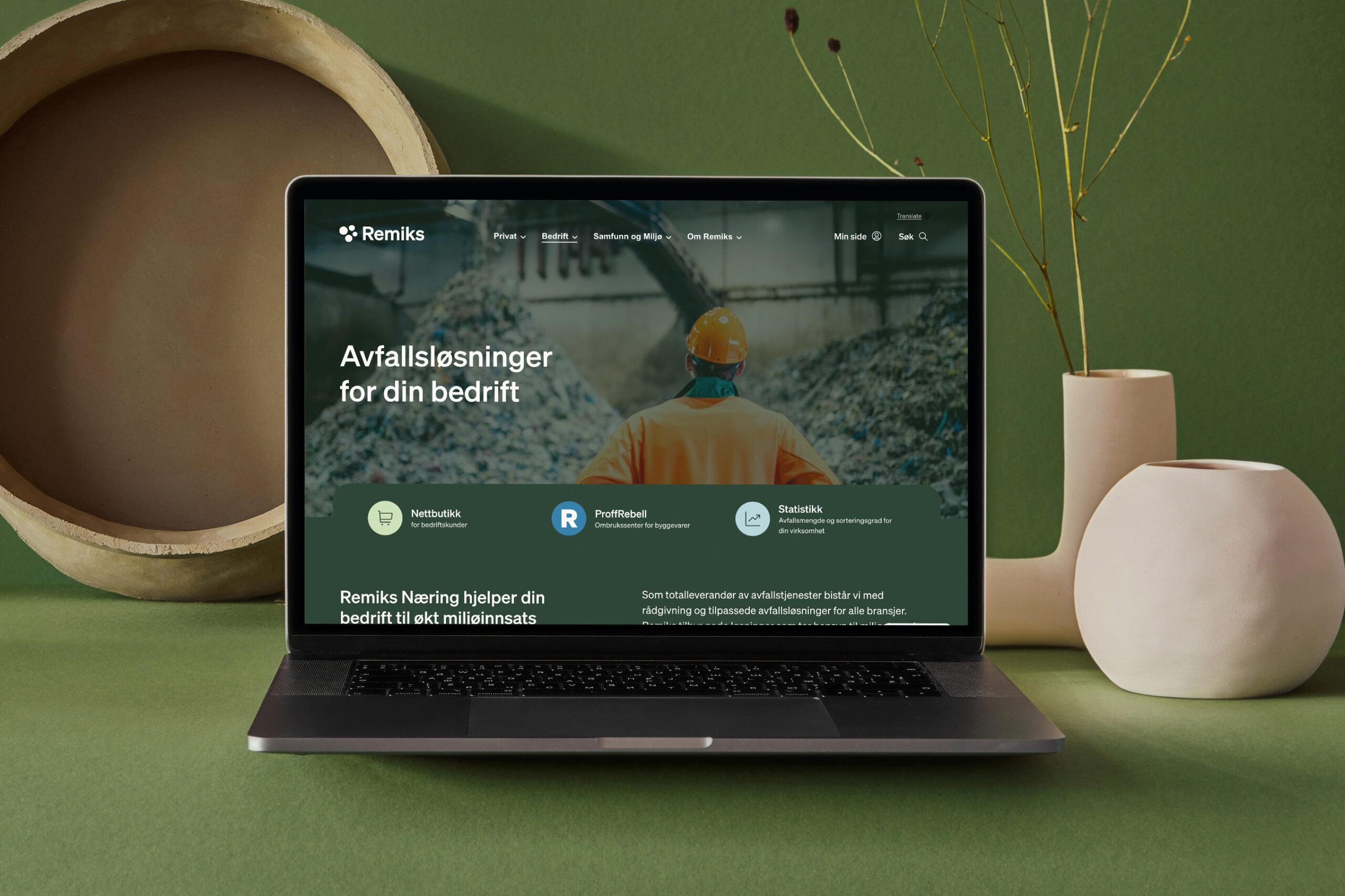 Mockup av nettsiden på en laptop