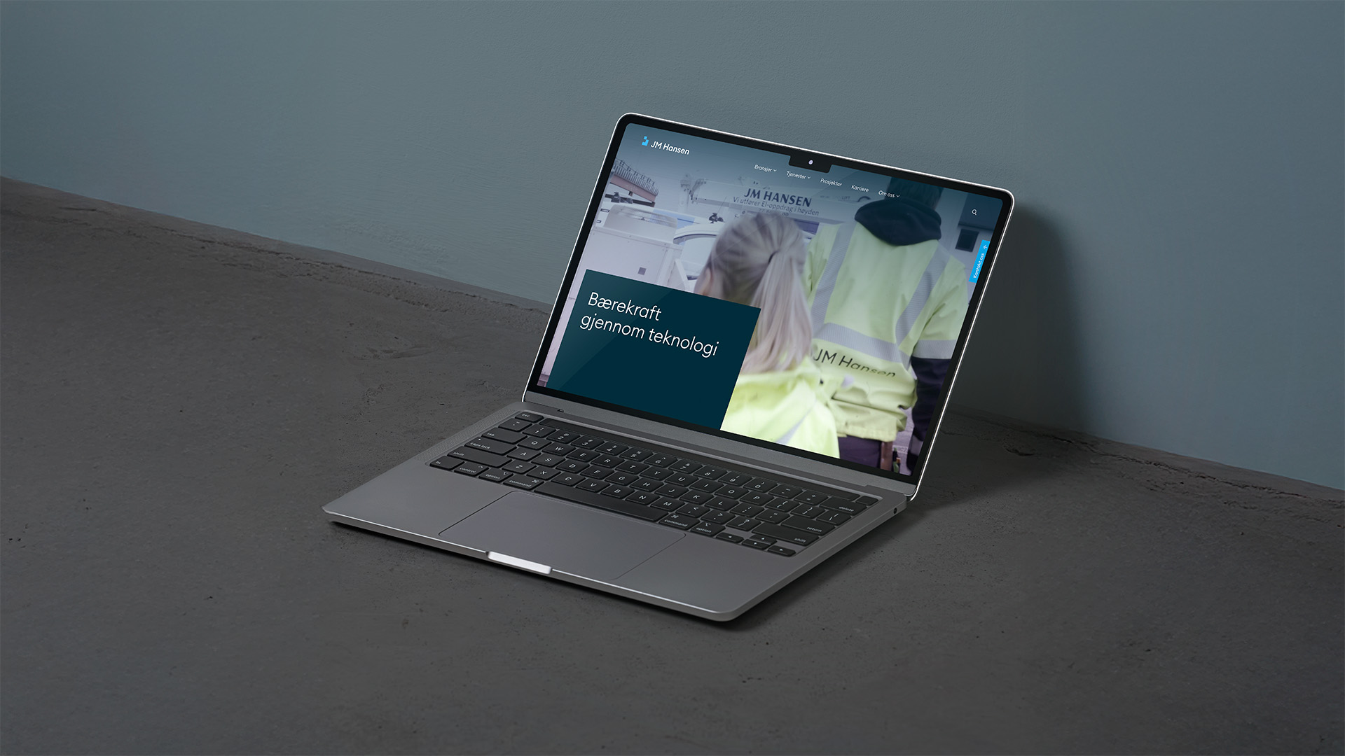 Mockup av nettsiden på en laptop